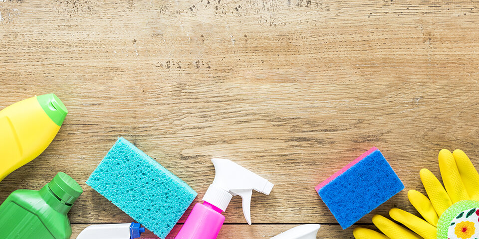 top-view-frame-with-cleaning-products-wooden-background low-res
