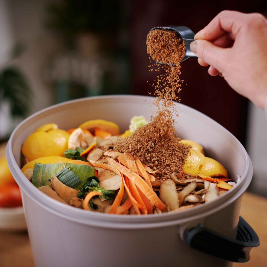 Sprinkling-bokashi-bran-in-Bokashi-Organko-Essential-(2) image-web